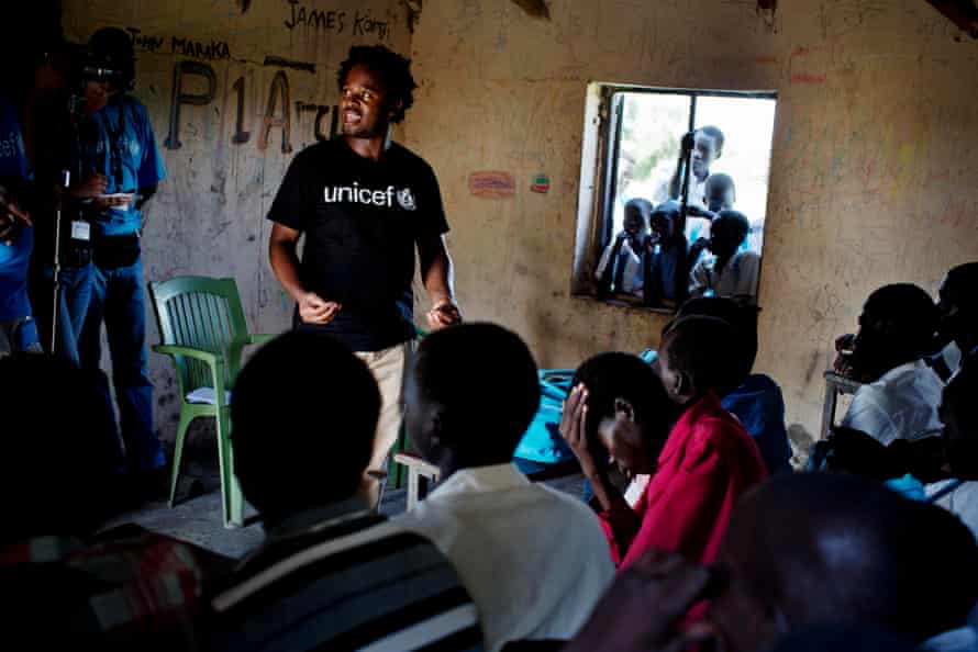 Ishmael Beah talks to a group of children in Pibor