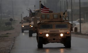 US troops drive through Manbij in north-west Syria