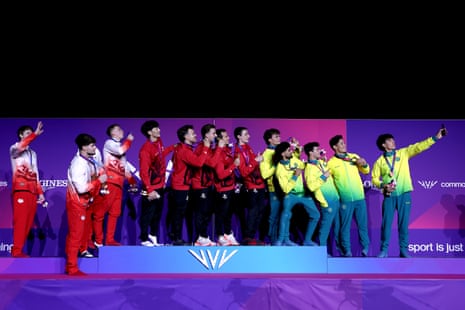 Gold medalists of Canada, silver medalists of England and bronze medalists of Australia pose for a selfe during the medal ceremony for the men's team final.