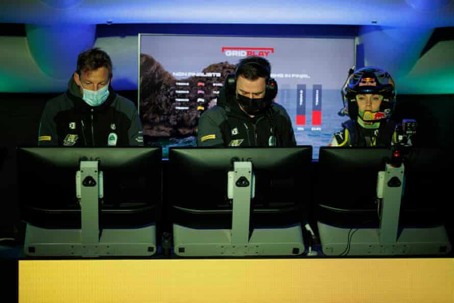 Jenson Button (left), the JBXE team owner, watches the action in the command centre.