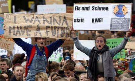 Students hold placards as they take part in a global climate strike in Berlin