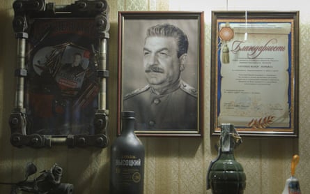 At the Luhansk base of the Night Wolves Russian biker gang, a portrait of Stalin shares a wall with a grenade