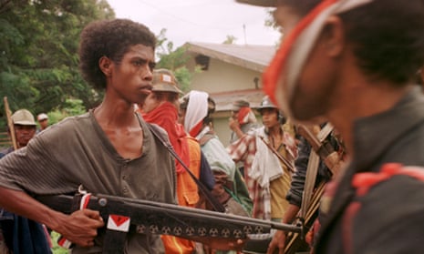 Members of the anti-independence East Timorese militia Besi Mera Putih (Iron Red and White) before attacking pro-independence supporters in the town of Liquica, East Timor