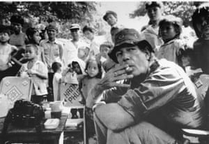 Page surrounded by children at a coffee stand in Chimpou, Cambodia, 27 November 1991