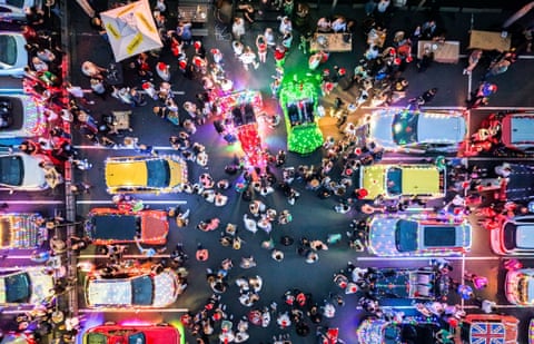 An aerial image of cars decorated with Christmas paraphernalia