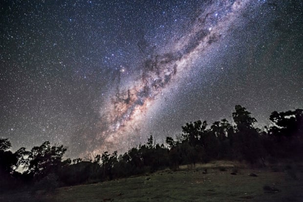The southern Milky Way and galactic centre rising on an April night in Australia, with the constellations of Sagittarius and Scorpius coming up, and the bulge of the galactic centre above the treetops