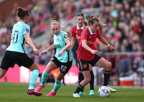 Manchester United's Ella Toone in action with Brighton’s Katie Robinson.