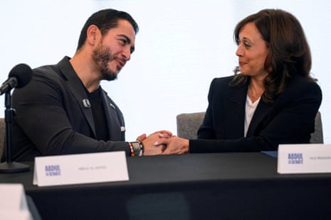 A man and woman shaking hands.