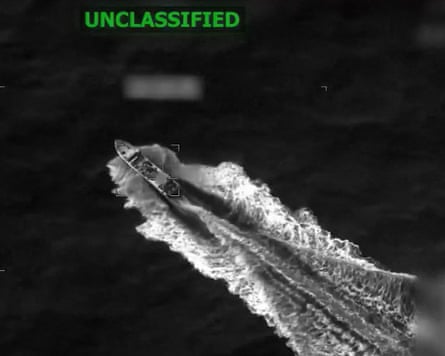 An aerial view of a small boat at sea