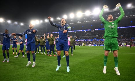 Désiré Doué, Marquinhos and Gianluigi Donnarumma celebrate at full-time following PSG’s win at Aston Villa.