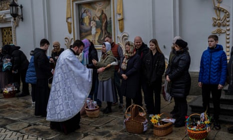 Orthodox Christian worshipers and their traditional Easter baskets are blessed during Easter Sunday at the Pechersk Lavra monastic complex in Kyiv