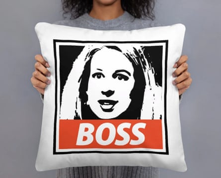 A pillow with a picture of Elizabeth Holmes is emblazoned with “Boss”.
