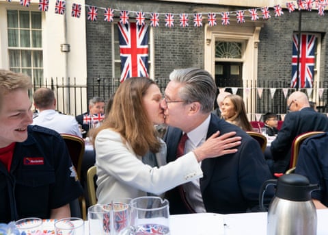 Keir Starmer kisses his wife during a street party in Downing Street