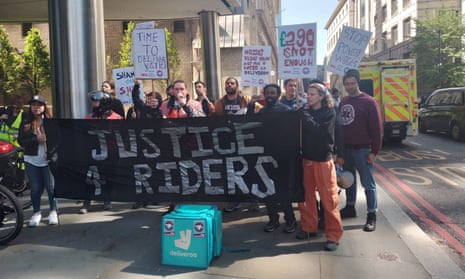 Deliveroo riders gather outside 100 Bishopsgate, London, to protest against the company's working conditions and low pay.