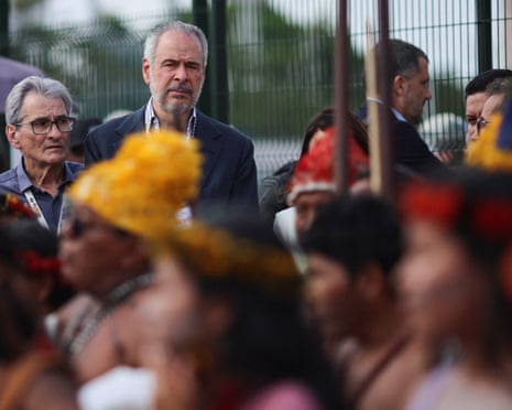 COP30 President Andre Correa do Lago meets indigenous people blocking access to the conference in Belem, Brazil