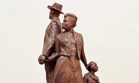 The statue will showcase three figures – a man, woman and child – dressed in their ‘Sunday best’ climbing a mountain of suitcases