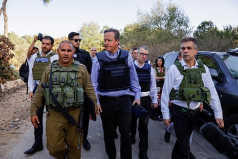 The British foreign secretary, David Cameron, and the Israeli foreign minister, Eli Cohen, visit kibbutz Be’eri on 23 November.