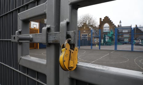 A lock hangs on a primary school gate in Deptford