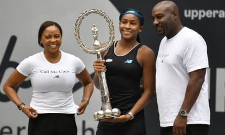 TENNIS-WTA-AUTCori Gauff of US (C) poses with the trophy next to her parents Gorey (R) und Candy Gauff after she won her WTA-Upper Austria Ladies final tennis match against Jelena Ostapenko of Latvia on October 13, 2019 in Linz, Austria. (Photo by BARBARA GINDL / APA / AFP) / Austria OUT (Photo by BARBARA GINDL/APA/AFP via Getty Images)
