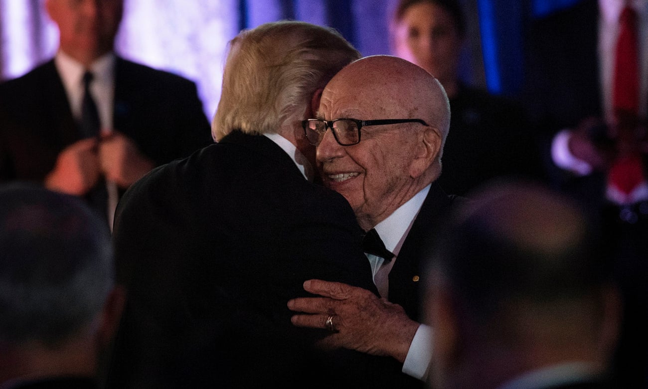 Donald Trump is embraced by Rupert Murdoch during a dinner in New York in 2017.