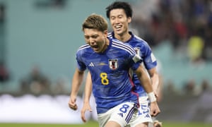Japan's Ritsu Doan celebrates scoring the equaliser against Germany, a match they go on to win.