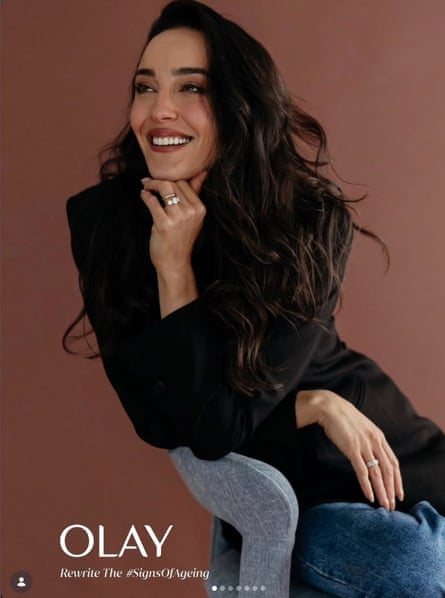A portrait of Gelmi with an Olay logo