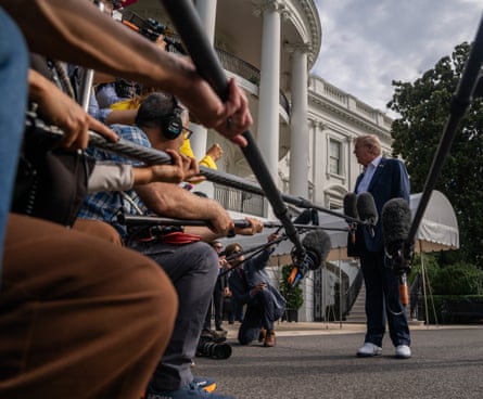 Donald Trump speaks to the press before boarding Marine One to attend the Ryder Cup.