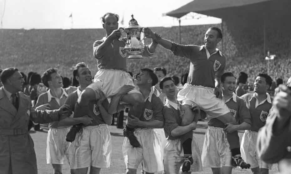 Stanley Matthews and captain Harry Johnston are carried on the shoulders of their teammates.