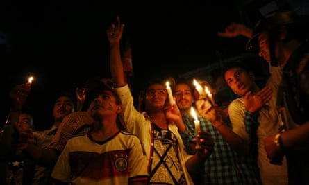 People light candles in Kathmandu to celebrate the adoption of  Nepal’s new constitution.