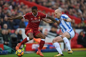 Liverpool’s Georginio Wijnaldum holds back Huddersfield’s Aaron Mooy as The Reds win 3-0 at Anfield.