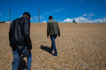 Two Sudanese asylum seekers on a beach on the Kent coast.