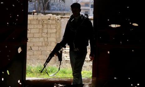 A member of the Free Syrian Army bearing a rifle