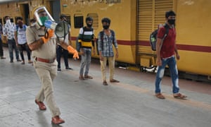 Railway Police miking for passengers of 1st Shramik Special Train from Mumbai to maintain social distance to fight against coronavirus, 17 May 2020.