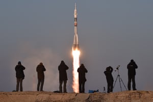 Photographers take pictures as Russia’s Soyuz TMA-19M spacecraft carrying the International Space Station (ISS) Expedition 46/47 crew of Britain’s astronaut Tim Peake, Russian cosmonaut Yuri Malenchenko and US astronaut Tim Kopra blasts off from the launch pad at Russian-leased Baikonur cosmodrome on December 15, 2015. AFP PHOTO / KIRILL KUDRYAVTSEVKIRILL KUDRYAVTSEV/AFP/Getty Images