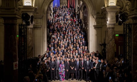 Anne Hidalgo, mayor of Paris (centre) stands for a photograph with some of the 500 mayors attending the UN COP21 climate summit at City Hall in Paris on 4 Dec 2015