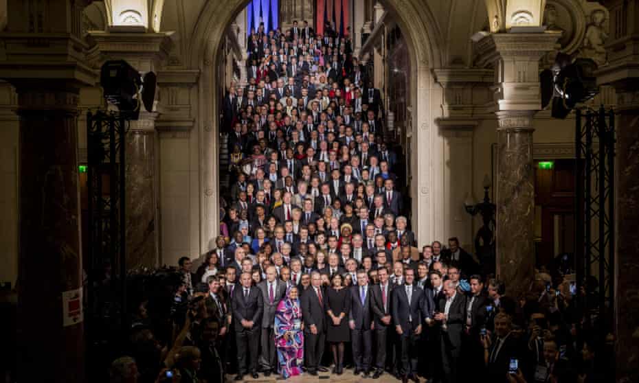 Anne Hidalgo, mayor of Paris (centre) stands for a photograph with some of the 500 mayors attending the UN COP21 climate summit at City Hall in Paris on 4 Dec 2015