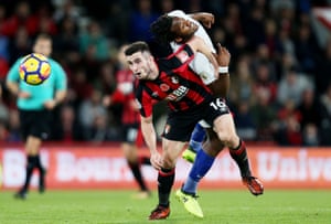 Michy Batshuayi of Chelsea heads over Lewis Cook of Bournemouth.