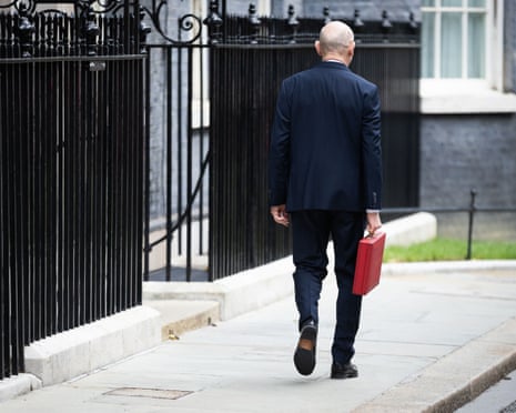 Chancellor of the Exchequer John Healey with the red budget briefcase in Downing Street, London, on 28 October.