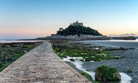 The sea causeway at low tide leading to St Michael’s Mount a small isle off Marazion near Penzance in Cornwall
