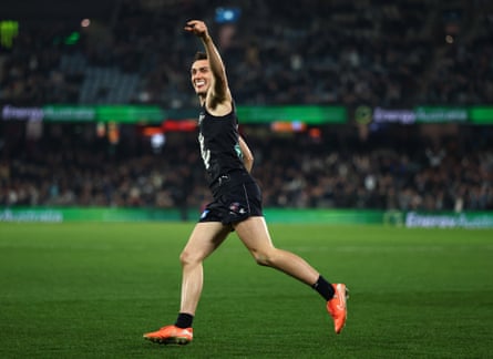 Jagga Smith celebrates kicking a goal against Brisbane at Marvel Stadium.