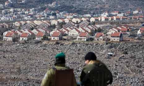 Israeli border police guard the West Bank settlement of Ofra