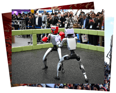 Robots demonstrate their boxing ability in front of a crowd at an exhibition in Tokyo, Japan.
