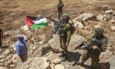 Palestinian protester confronts Israeli soldiers