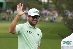 Corey Conners celebrates after a hole-in-one on the sixth hole.
