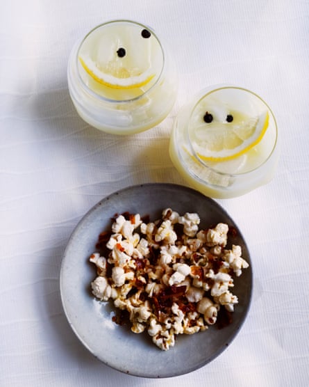 Bowl of popcorn and two glasses of lemonade