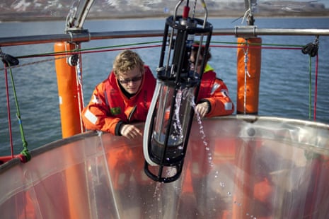 Scientists haul in samples of seawater in Svalbard, Norway. Greenpeace is working with the German marine research institute to investigate ocean acidification