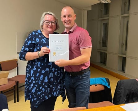 Peter receiving a certificate with his Reading Coach Alison Hollinrake, from Read Easy