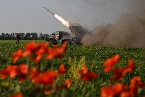 A missile being fired from a field of poppies