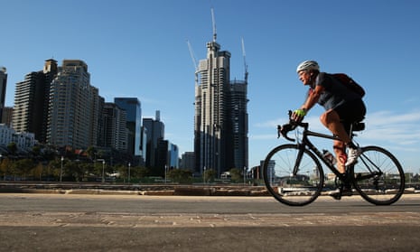 A cyclist goes past Sydney's Barangaroo redevelopment