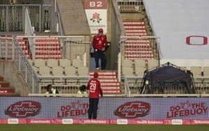 England’s Tom Banton, top, retrieves the ball from stands after a six from Pakistan’s Mohammad Hafeez.